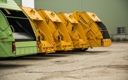 Vehicles waiting on a Millbank street for rubbish collection